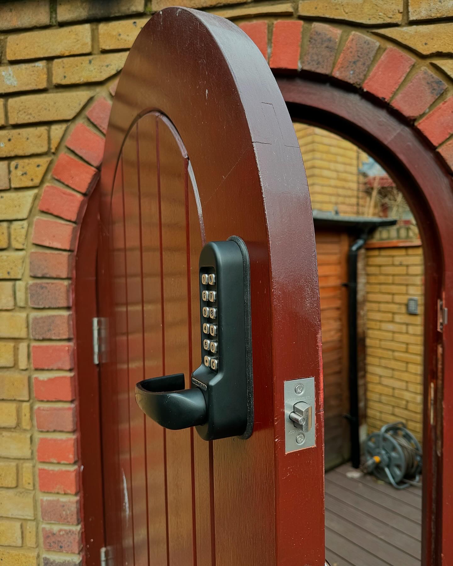 Heavy-duty weatherproof keypad code lock fitted to side garden door in Northolt